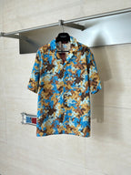 Gucci short-sleeve button-up shirt with blue and tan abstract pattern