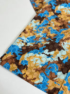 Short-sleeve shirt folded detail, blue and brown abstract pattern