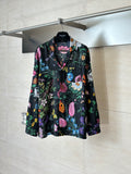 Black long-sleeve shirt with colorful floral pattern