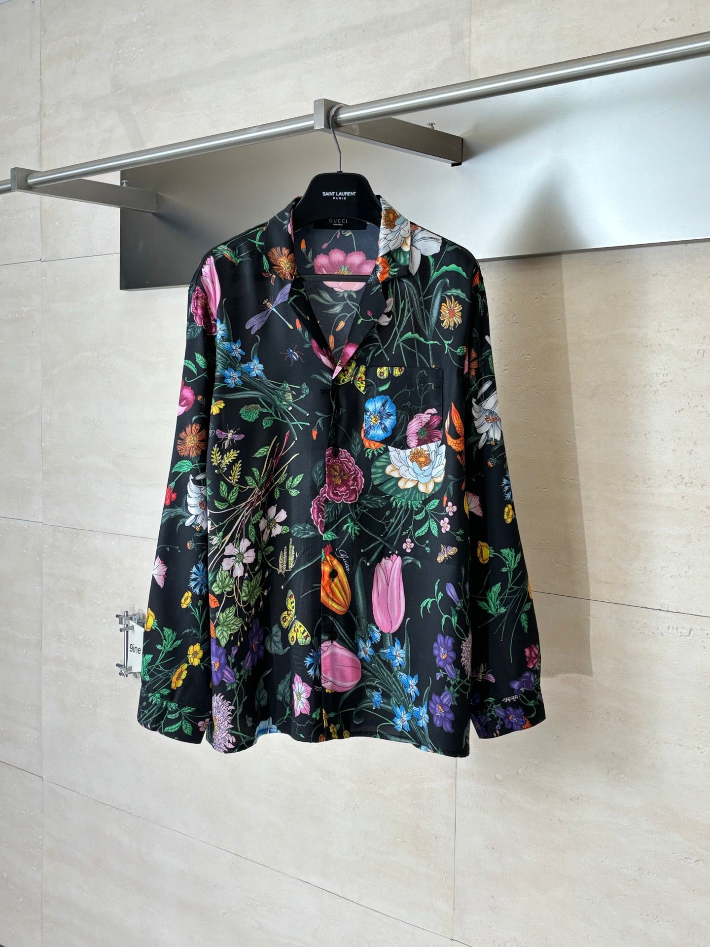 Black long-sleeve shirt with colorful floral pattern
