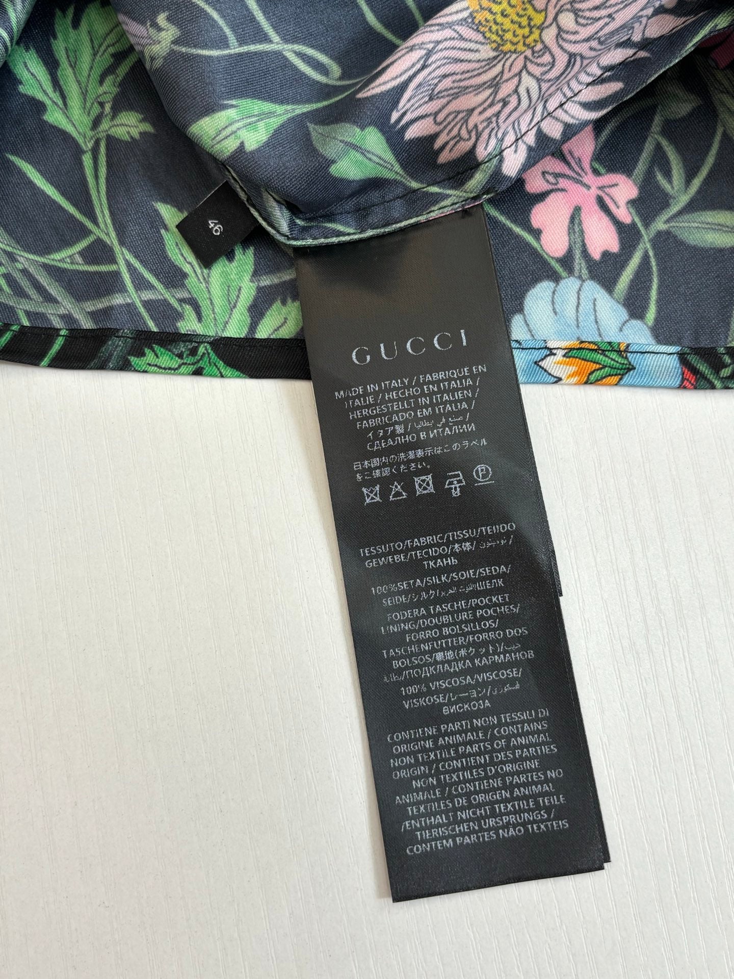 Gucci long floral shirt, dark base with pink and green flower print, with size tag