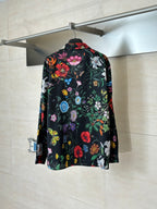 Long-sleeve shirt with colorful garden print on a dark background