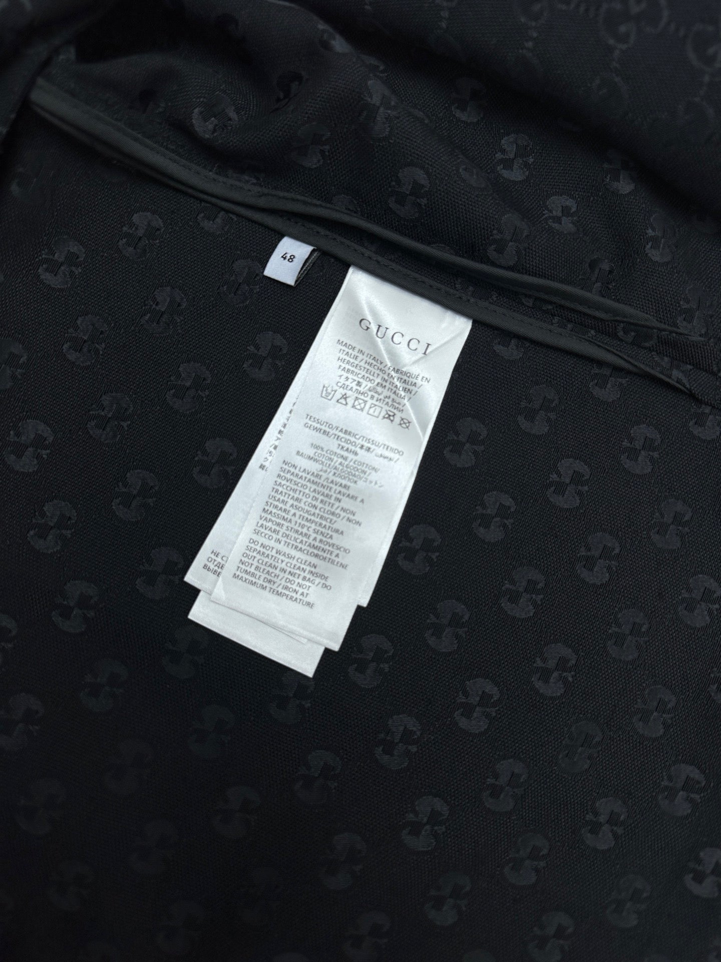 Dark navy short-sleeve shirt, neckline with size and care labels inside