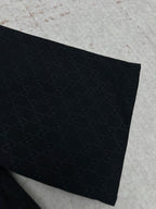Dark navy Gucci-pattern short-sleeve shirt sleeve and hem close-up