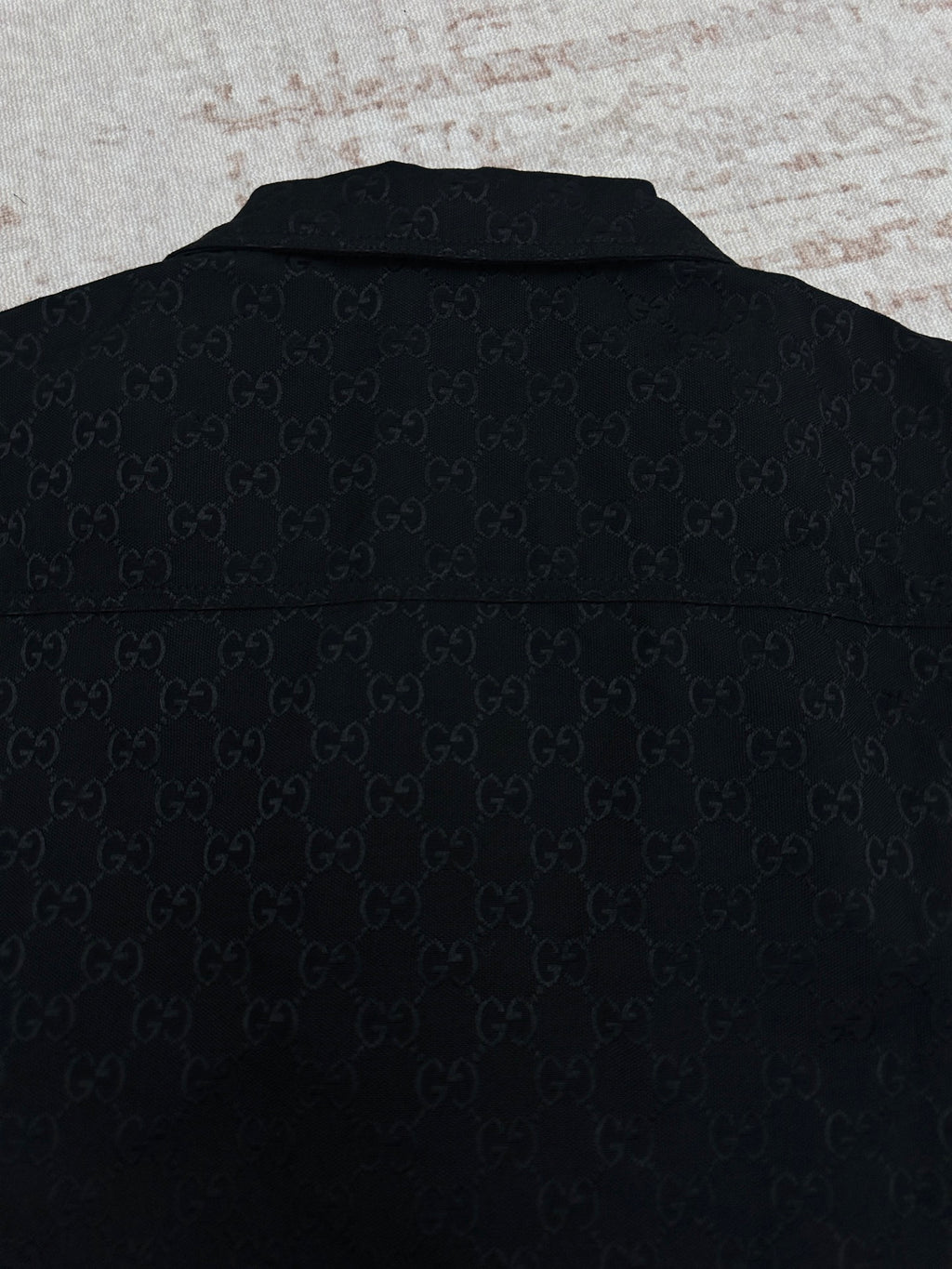 Dark navy Gucci-pattern short-sleeve shirt, back view with collar