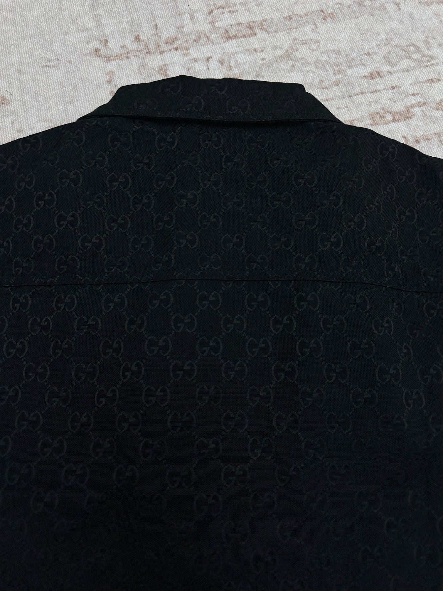 Dark navy Gucci-pattern short-sleeve shirt, back view with collar