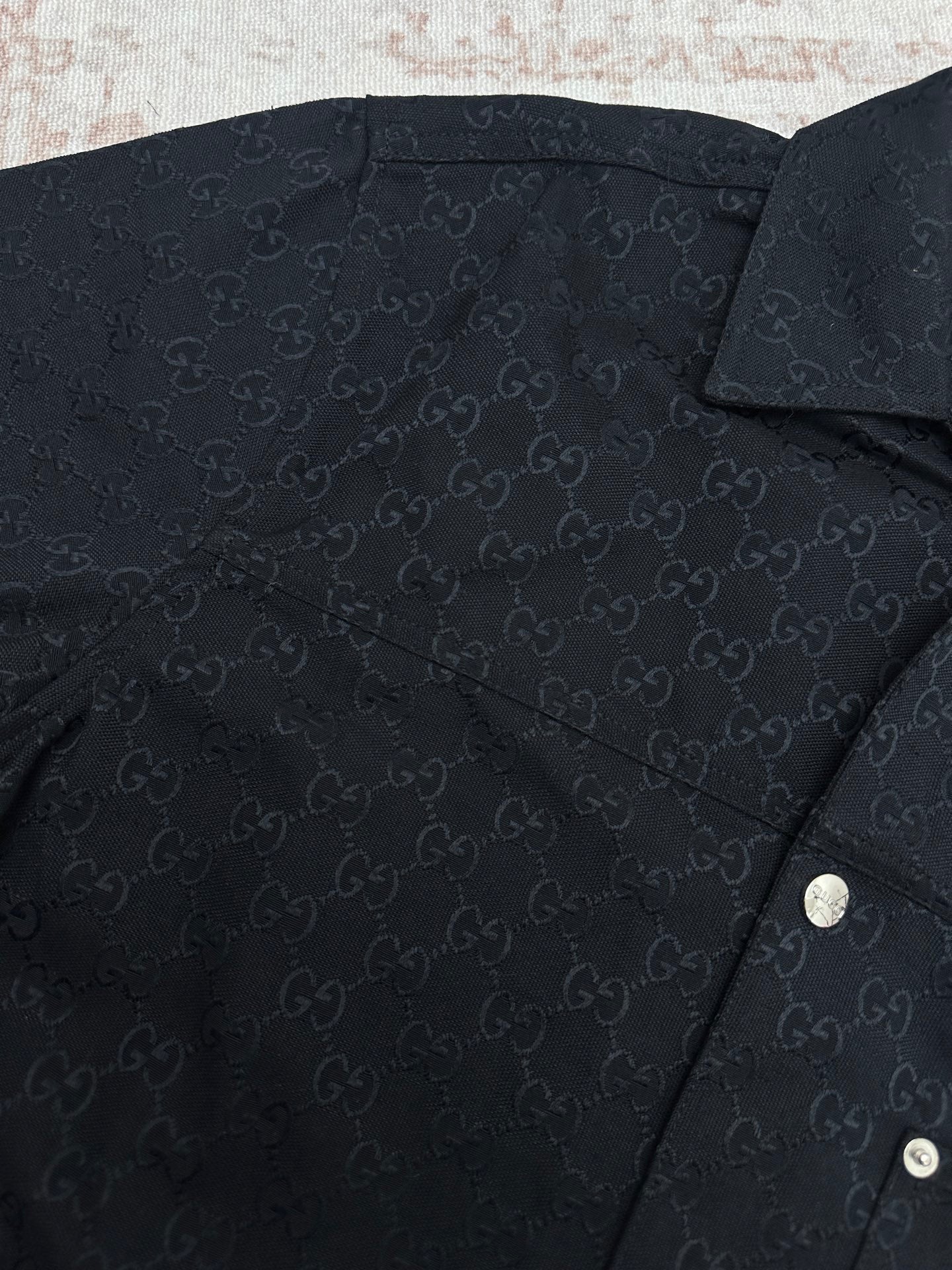 Dark navy Gucci monogram short-sleeve shirt fabric close-up