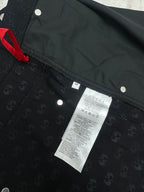 Gucci dark navy shorts with GG-style monogram pattern, care label and drawstring tag