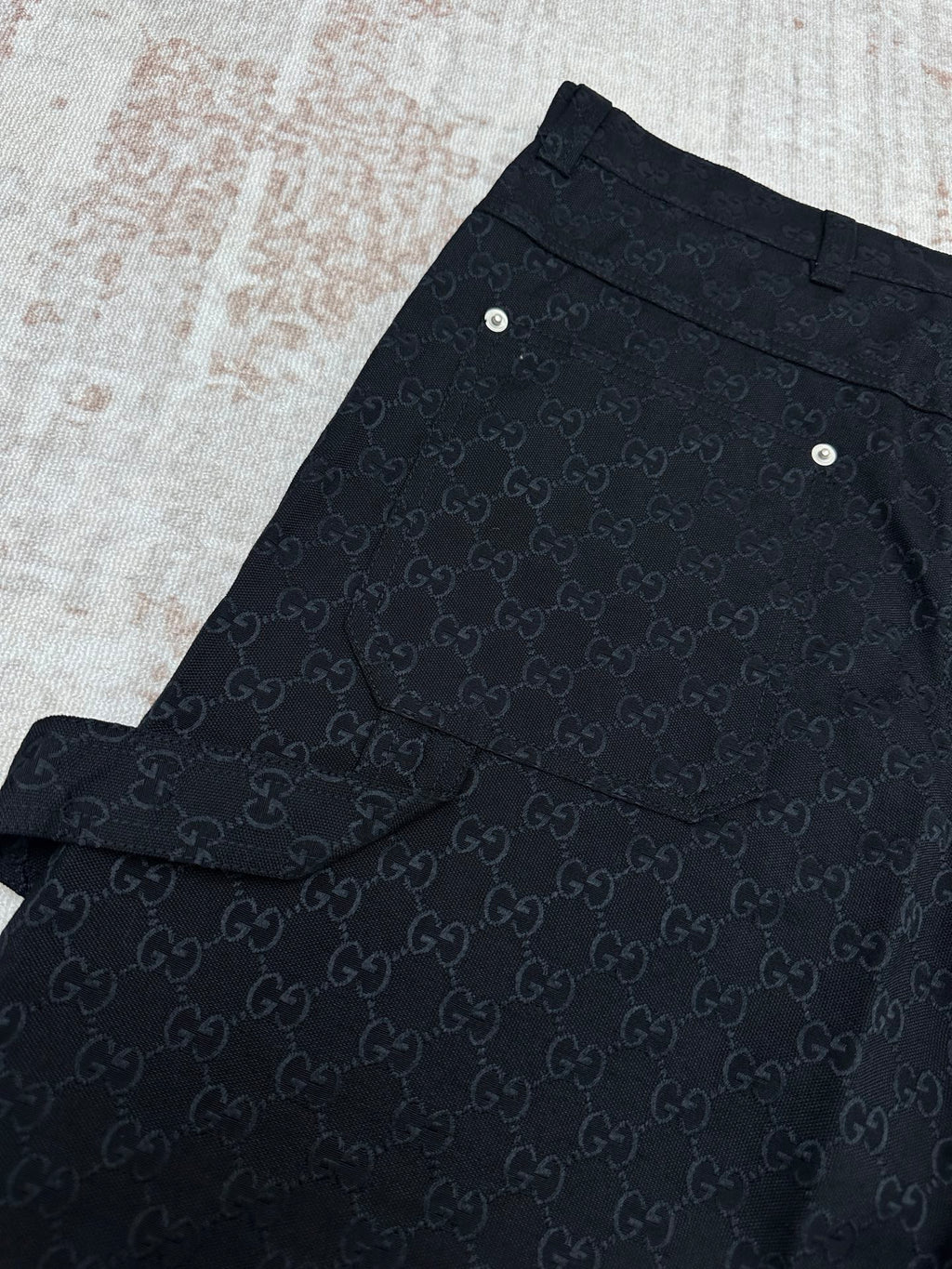 Gucci dark navy shorts with GG-style monogram pattern, pleated front and side pocket