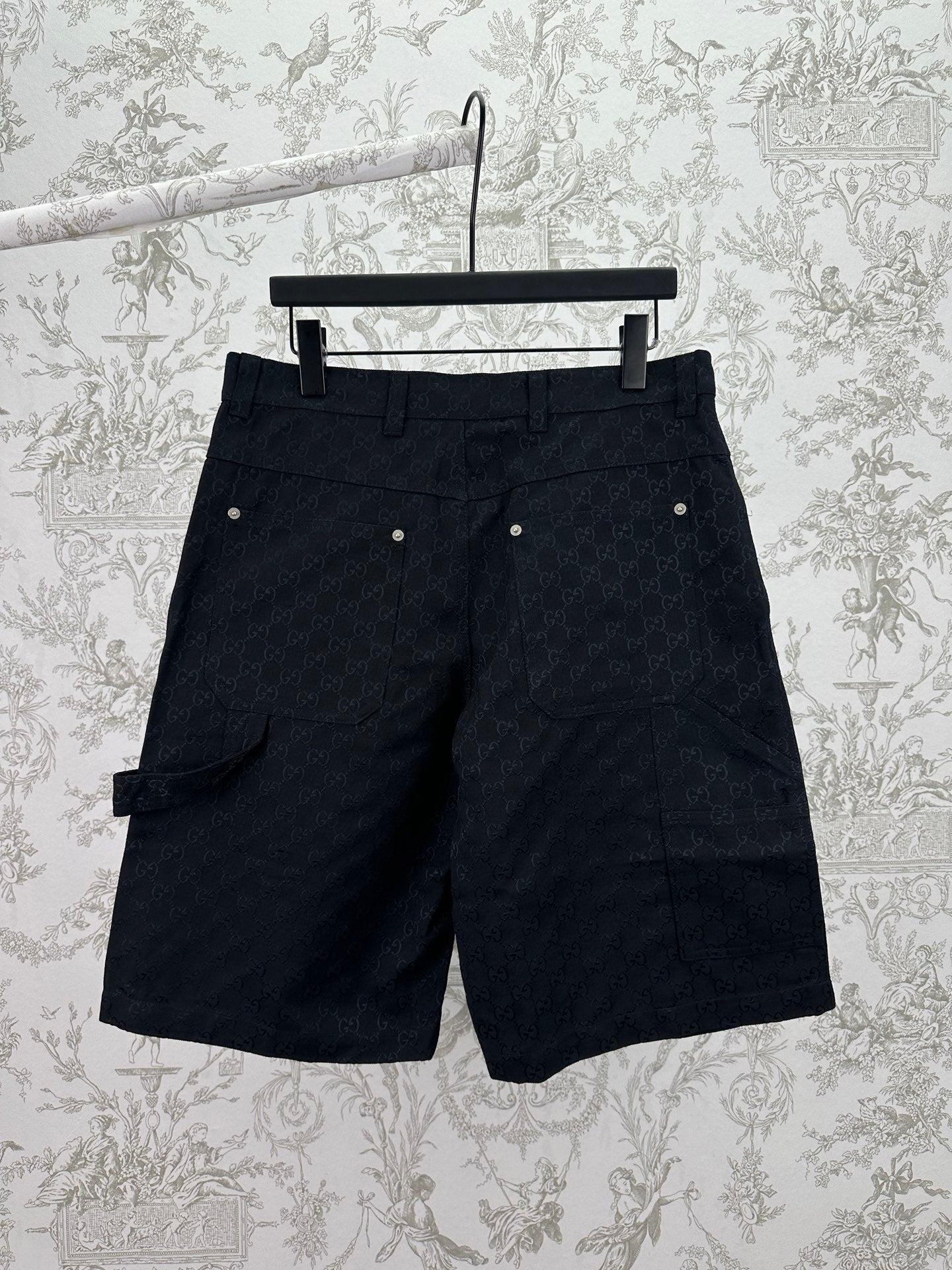 Gucci dark navy shorts with GG-style monogram pattern, belt loops and side pockets