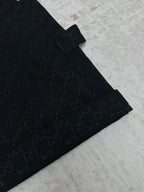 Gucci dark navy shorts with GG-style monogram pattern, angled front seam detail