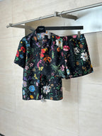 Gucci floral shorts set: dark shorts with colorful flower pattern