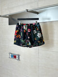 Gucci floral print shorts with black base and colorful flowers
