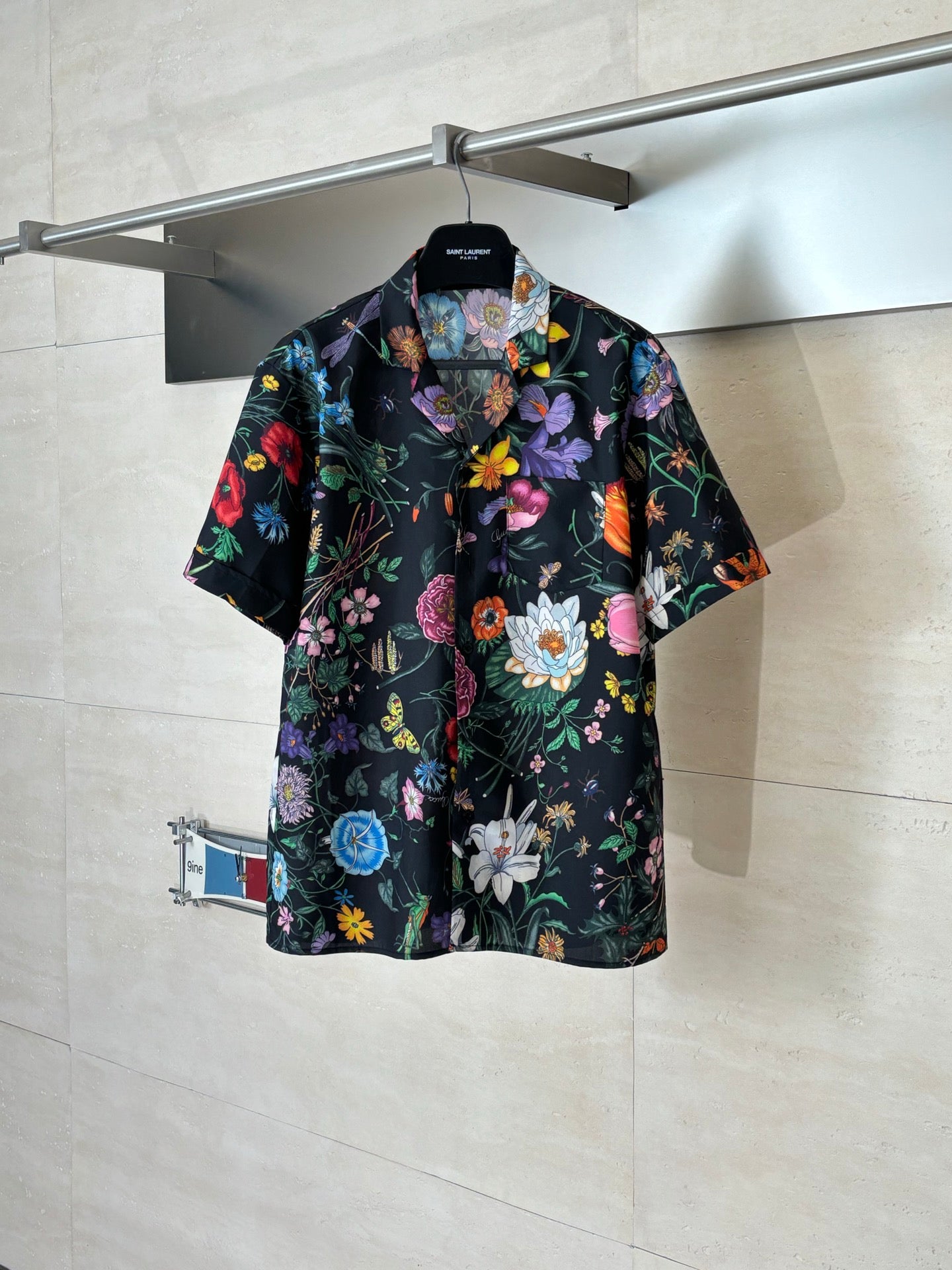 Black Gucci short-sleeve shirt with colorful floral and butterfly print, button-front