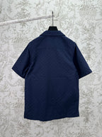 Dark navy short-sleeve button-up shirt, back view, with stand collar and straight hem