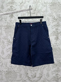 Gucci shorts in dark navy with button front, belt loops, and side pockets