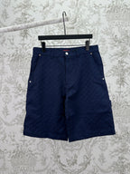 Gucci shorts in dark navy with button front, belt loops, and side pockets