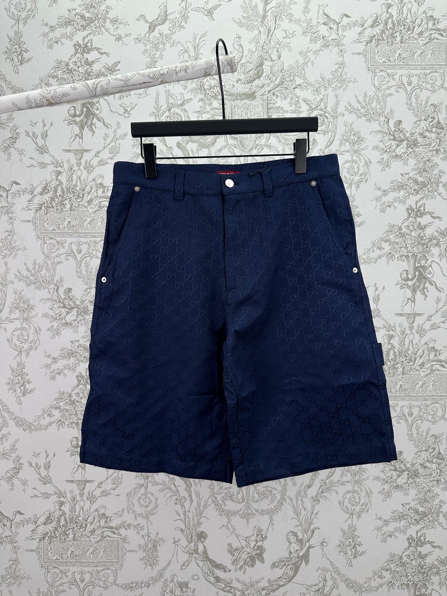 Gucci shorts in dark navy with button front, belt loops, and side pockets