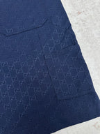 Gucci shorts in dark navy with monogram pattern, flap pocket, and button