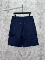 Gucci shorts in dark navy with flap pockets, button front, and belt loops