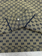 Gucci short-sleeve shirt collar detail with blue GG motif and button placket