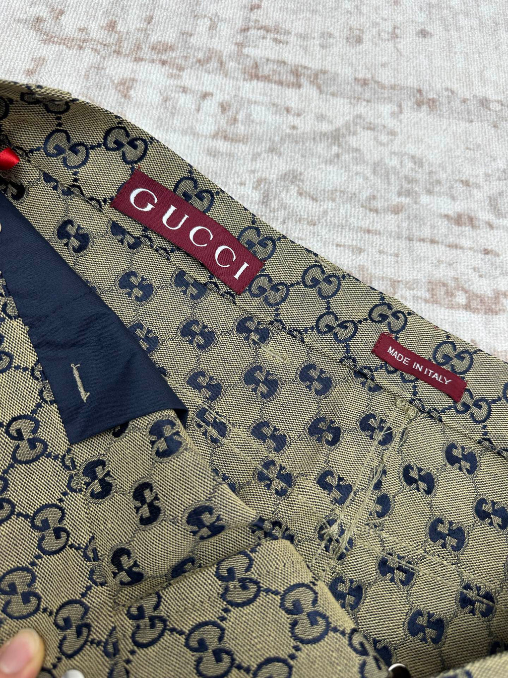Gucci shorts inner waistband label with GG print and red brand tab