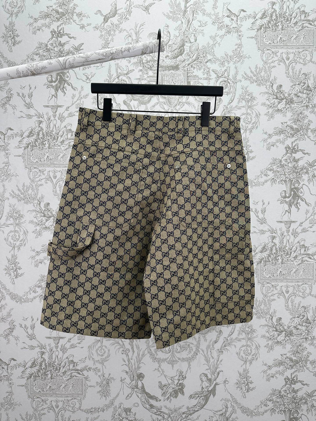 Gucci patterned shorts with allover GG print, side view, dark button front