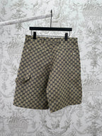 Gucci patterned shorts with allover GG print, side view, dark button front