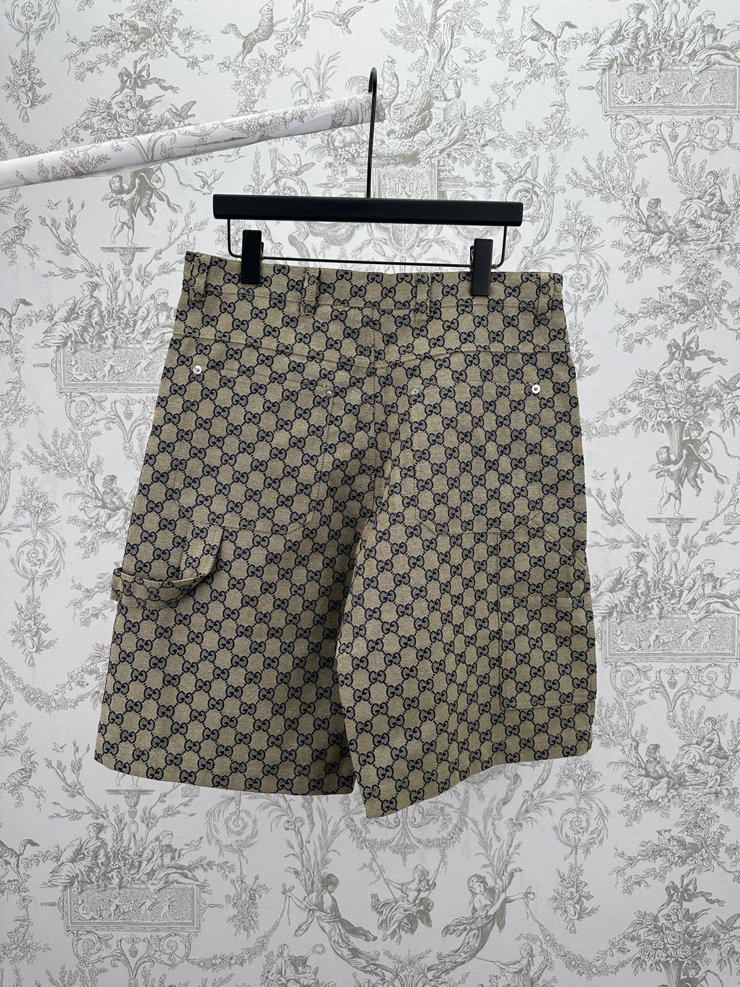 Gucci patterned shorts with allover GG print, side view, dark button front