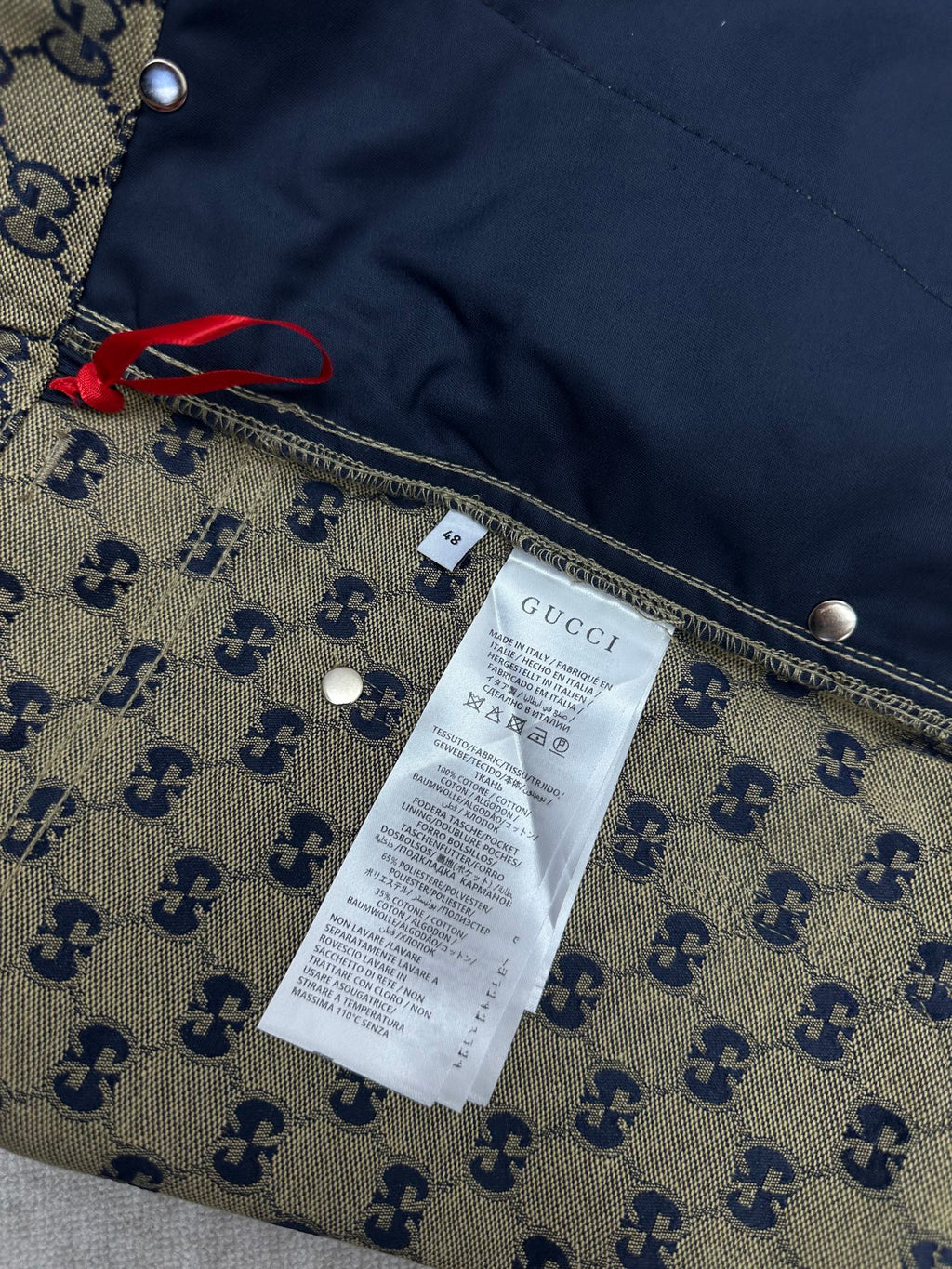 Gucci shorts interior label on GG monogram fabric with seam details