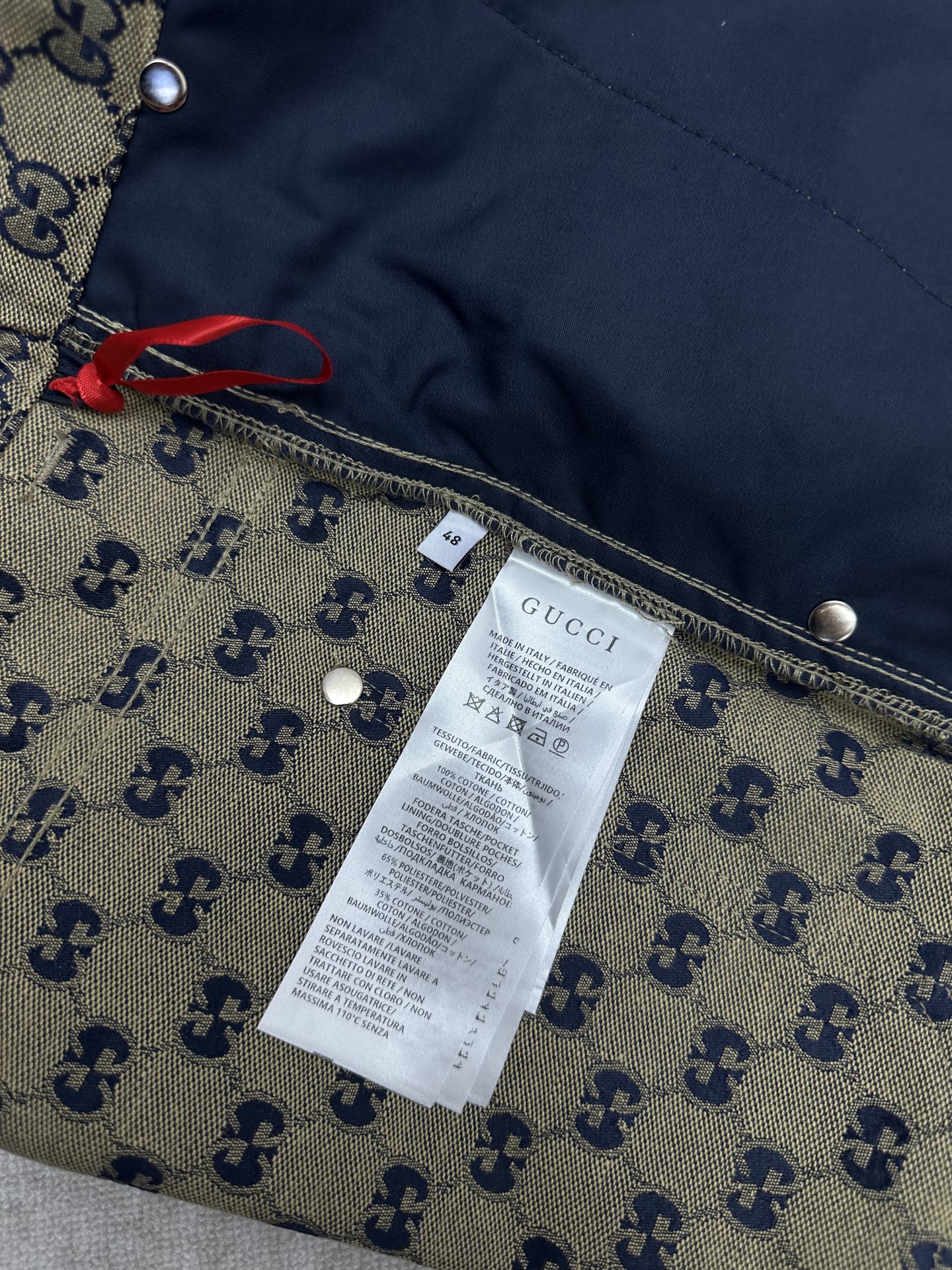 Gucci shorts interior label on GG monogram fabric with seam details