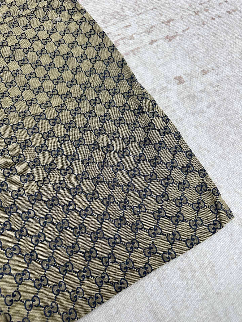 Gucci shorts close-up of GG monogram fabric with stitched hem