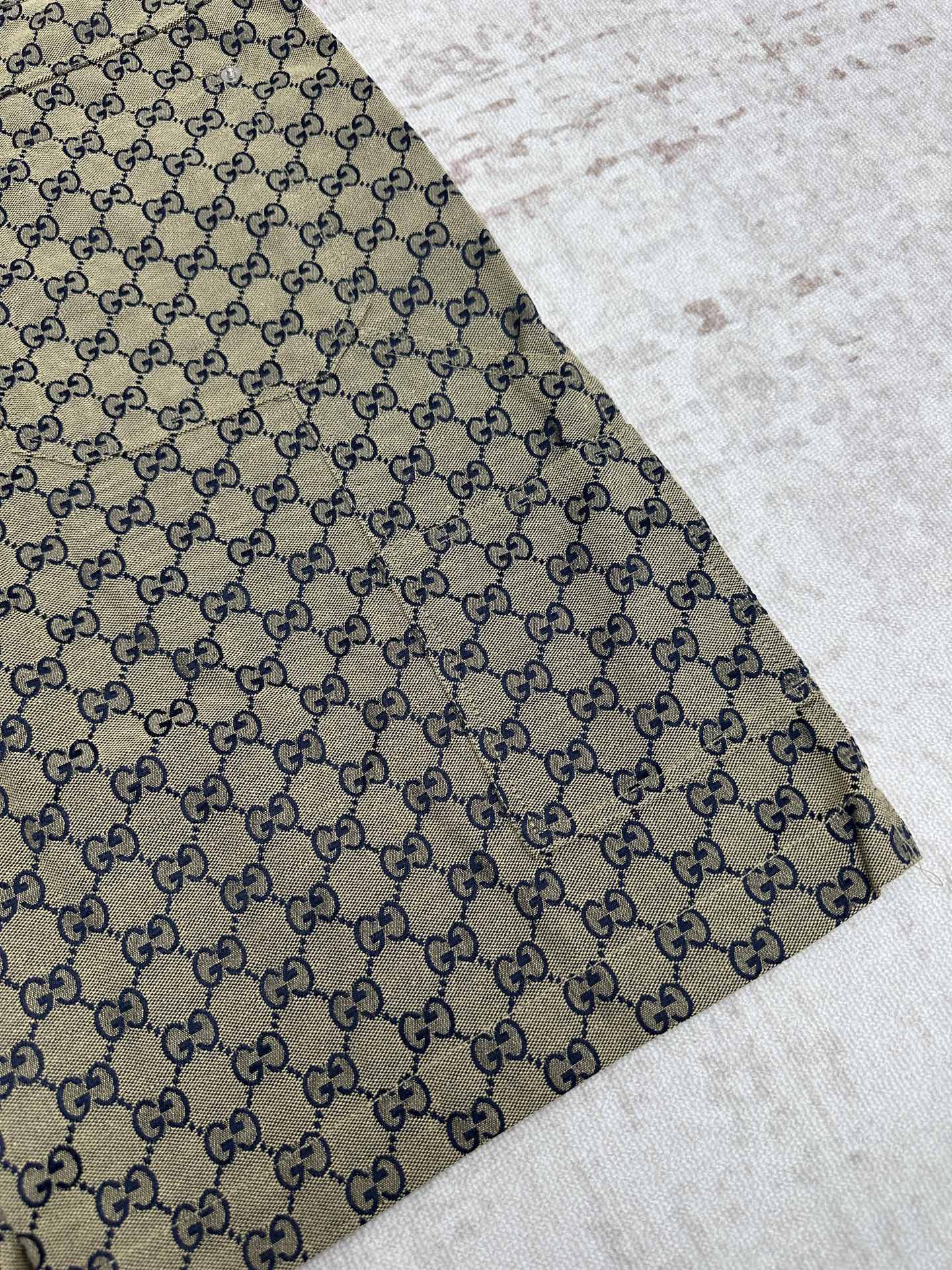 Gucci shorts close-up of GG monogram fabric with stitched hem