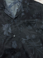 Short-sleeve shirt front, dark navy floral print, button placket and patch pocket