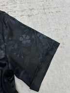 Short-sleeve shirt sleeve and shoulder, dark navy with subtle floral pattern