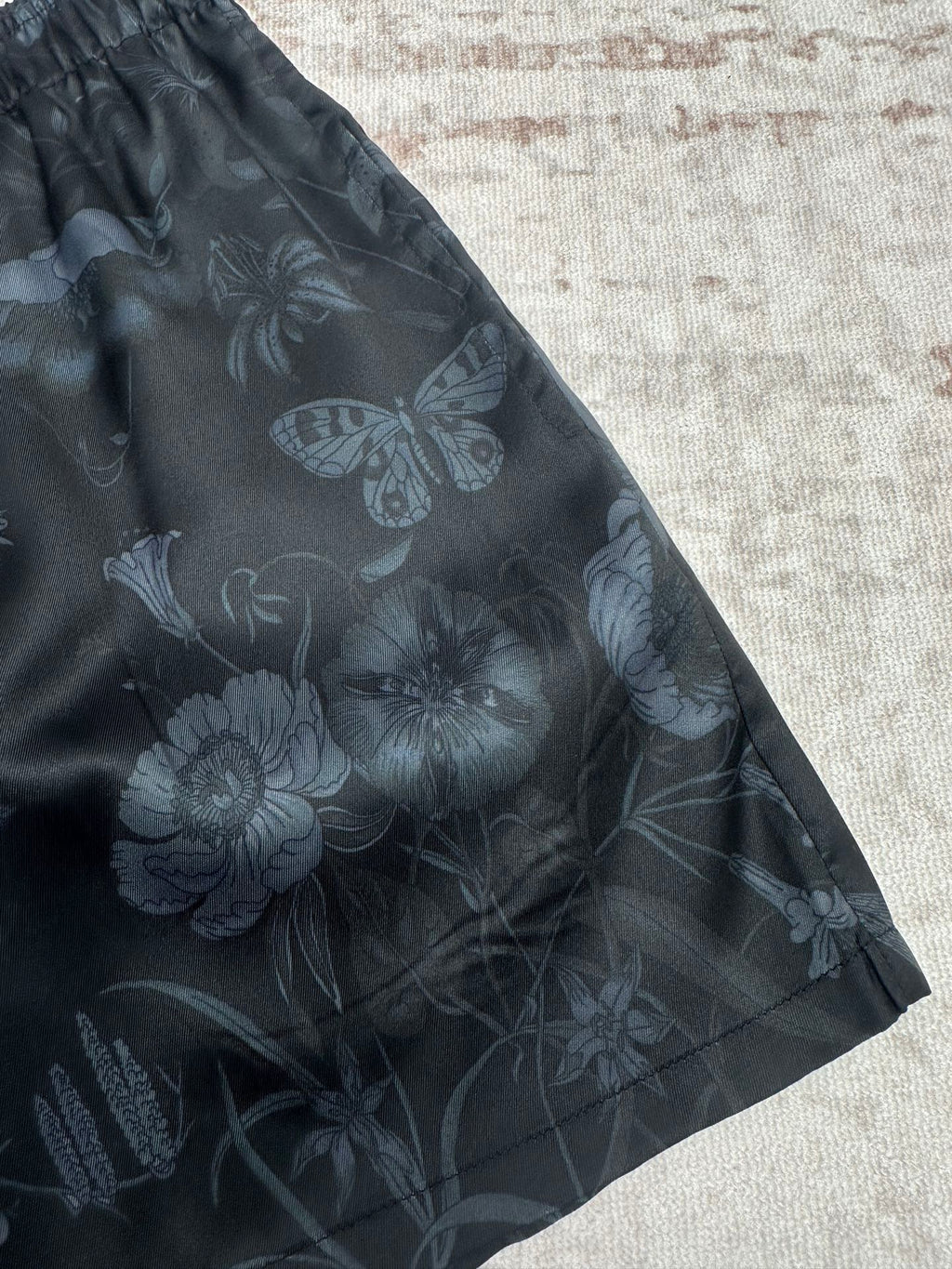 Dark floral shorts with allover flower and butterfly print