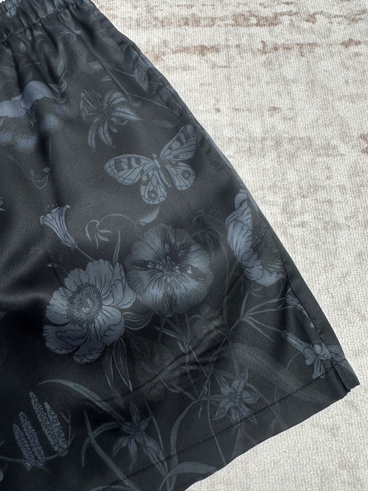 Dark floral shorts with allover flower and butterfly print