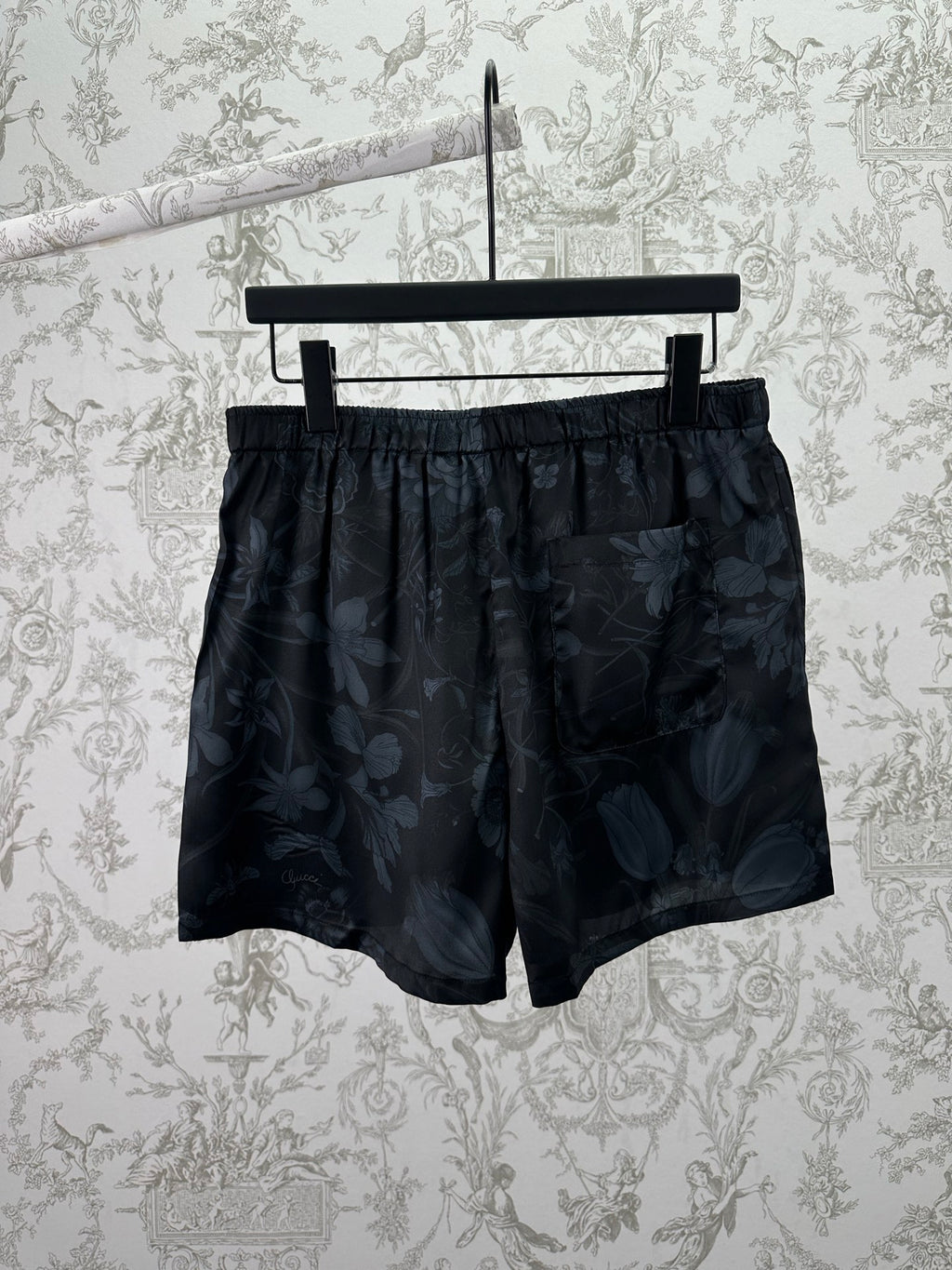 Dark floral shorts front view with elastic waistband