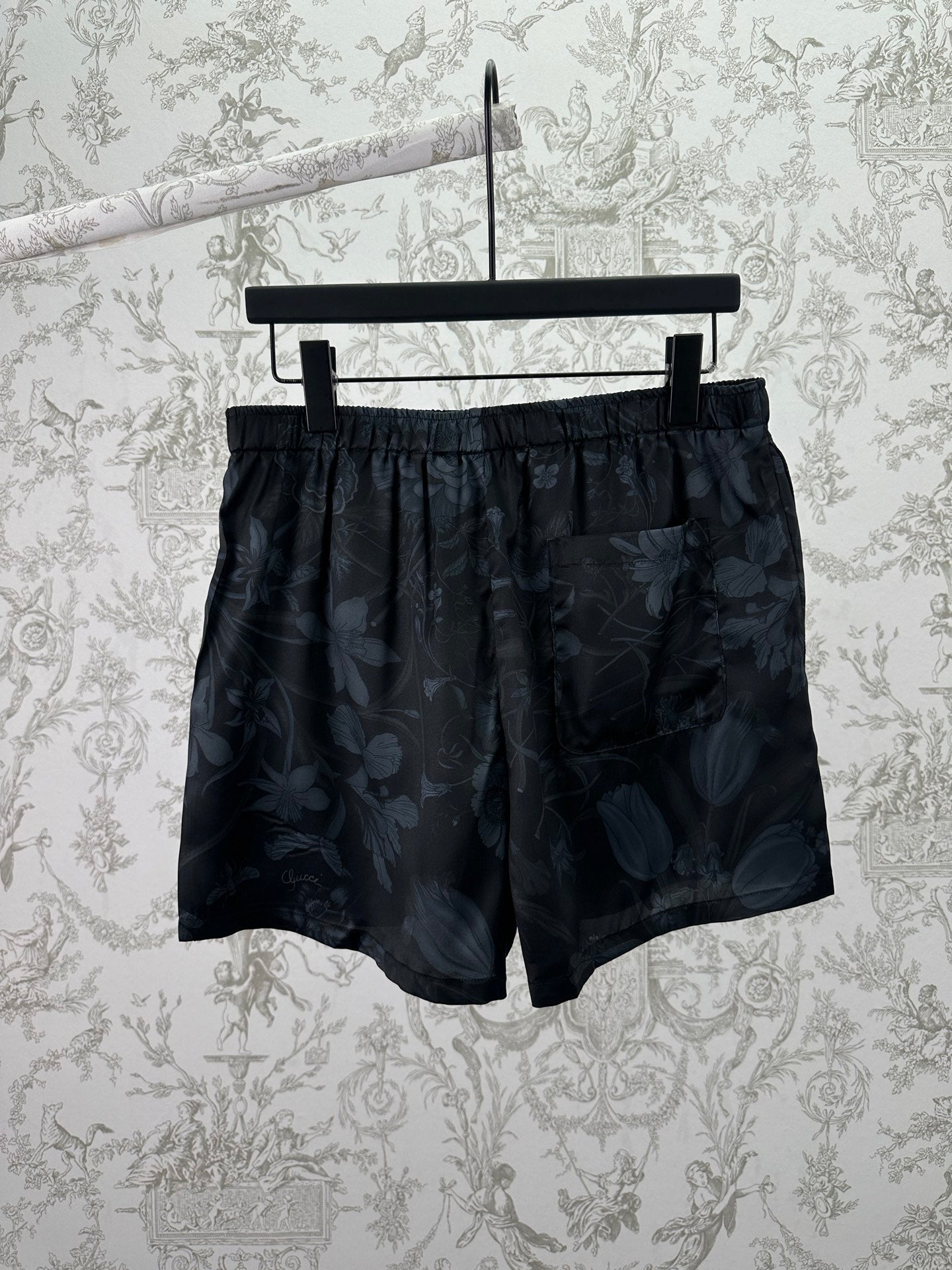 Dark floral shorts front view with elastic waistband