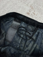 Dark floral shorts interior view showing care label and stitching