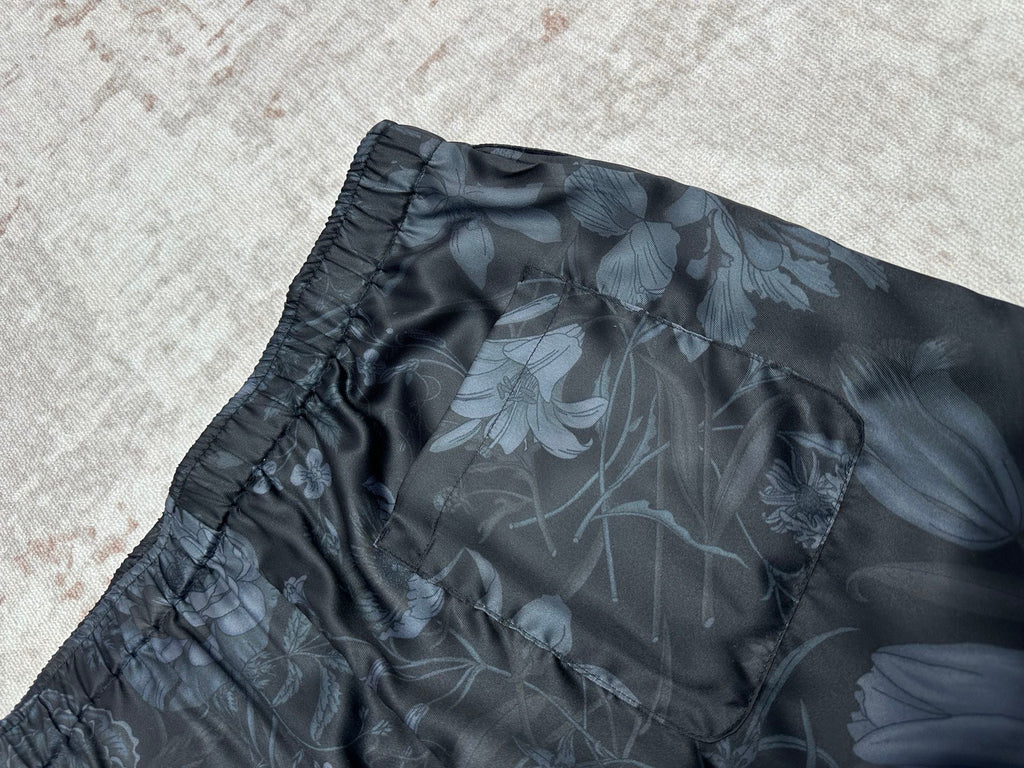 Dark floral shorts side view with gathered elastic waist