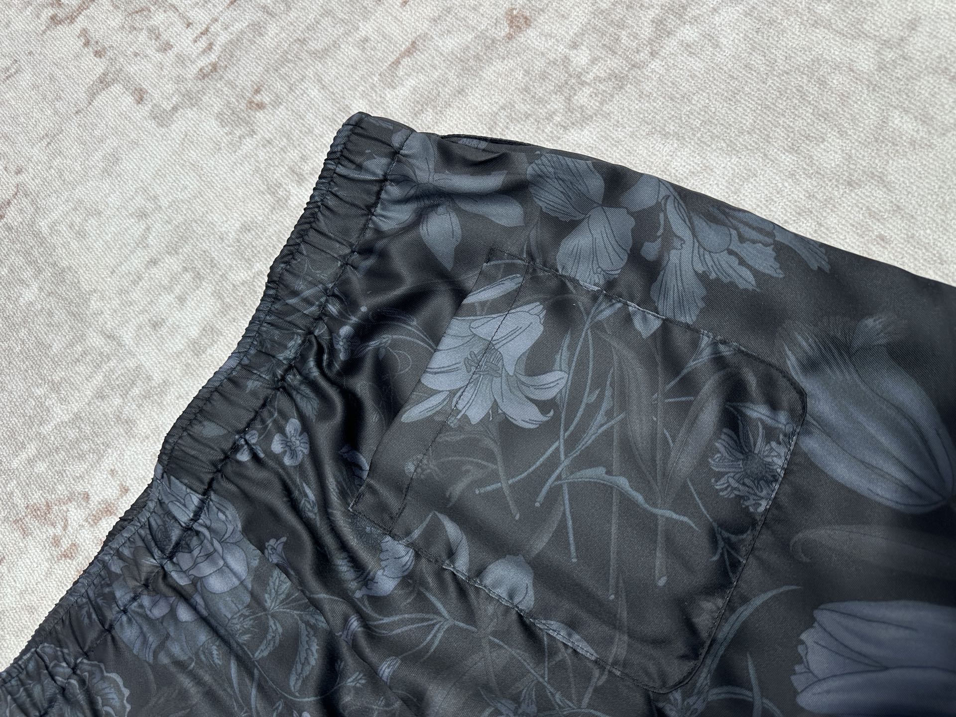 Dark floral shorts side view with gathered elastic waist