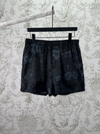 Gucci dark floral shorts with elastic waistband