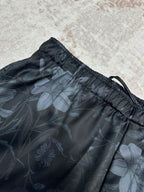 Dark floral shorts close-up with gathered elastic waist