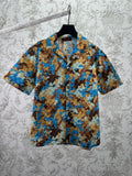 Short-sleeve button-up shirt with blue and tan bear print pattern