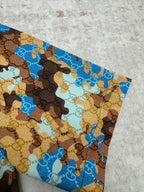 Short-sleeve shirt sleeve with blue and tan bear print pattern