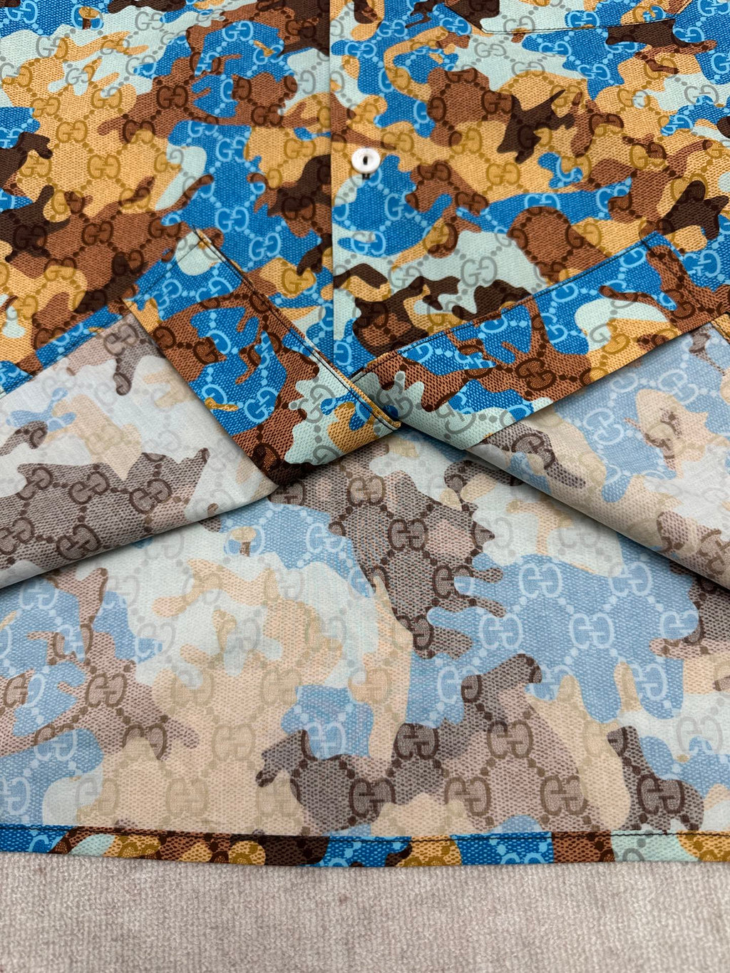 Short-sleeve shirt fabric draped, blue and tan bear print pattern