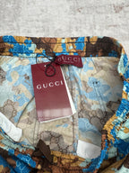 Gucci shorts waistband with Gucci tag and red interior paper label