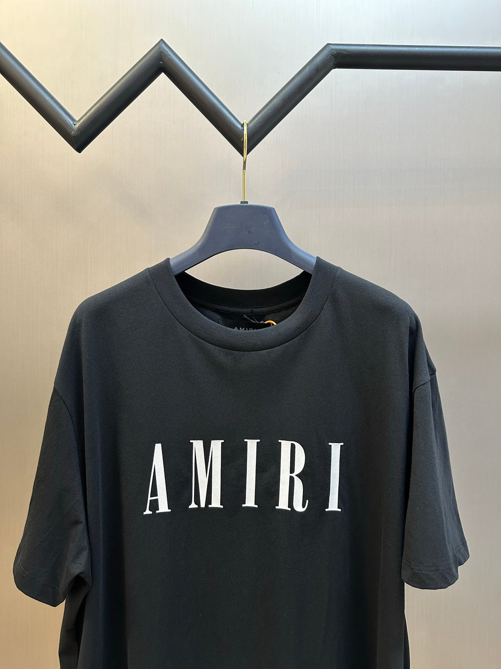 Black Amiri T-shirt with large AMIRI lettering across chest