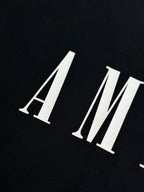 Black Amiri T-shirt with AMIRI logo in white letters